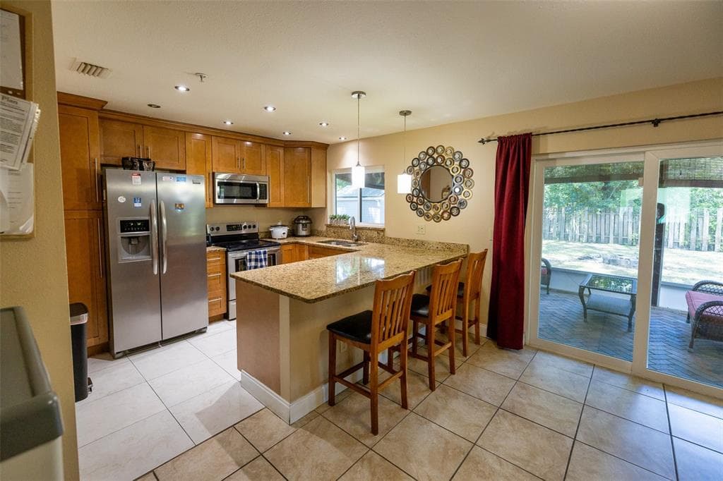7128 WRENWOOD CIRCLE, TAMPA, FL 33617 — zdjęcie 4