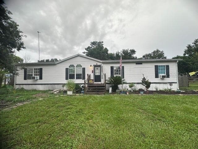 446 QUAIL STREET, LADY LAKE, FL 32159