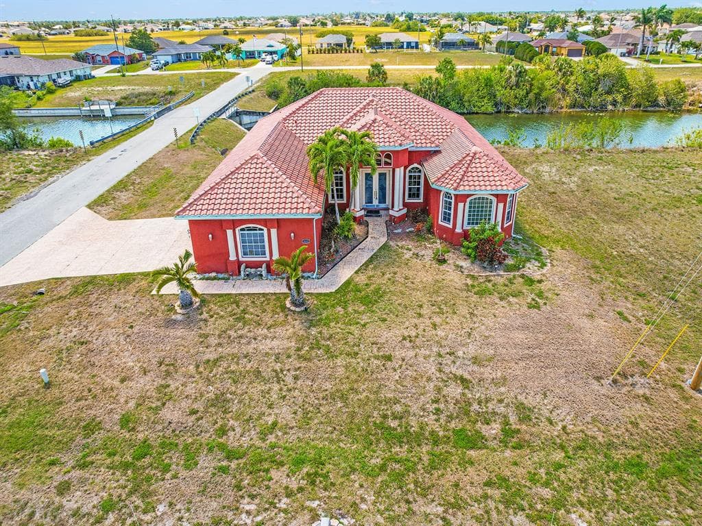 1112 NW 9TH AVENUE, CAPE CORAL, FL 33993