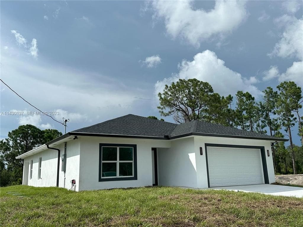 1125 MILWAUKEE BOULEVARD, LEHIGH ACRES, FL 33974