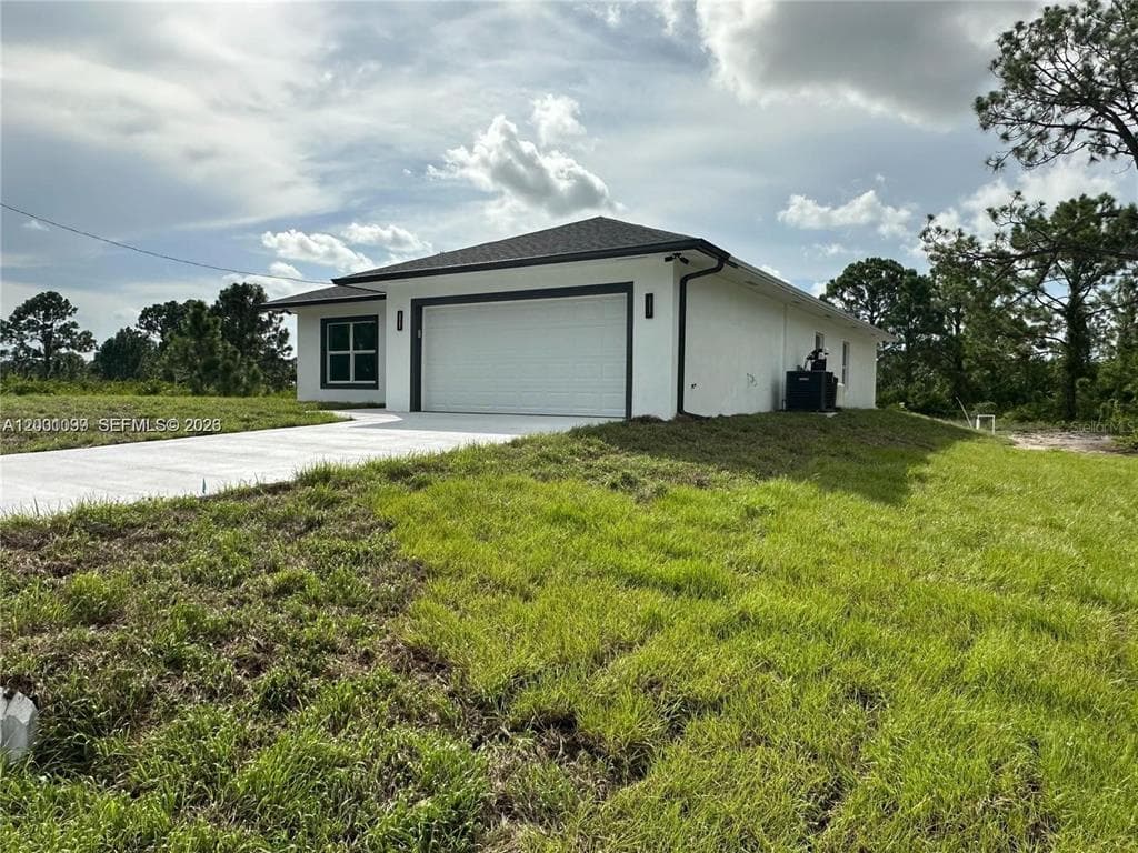 1125 MILWAUKEE BOULEVARD, LEHIGH ACRES, FL 33974