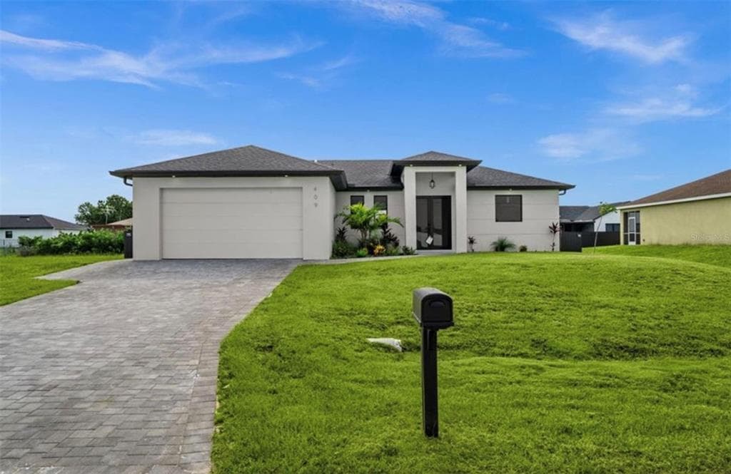 409 NW 25TH PLACE, CAPE CORAL, FL 33993